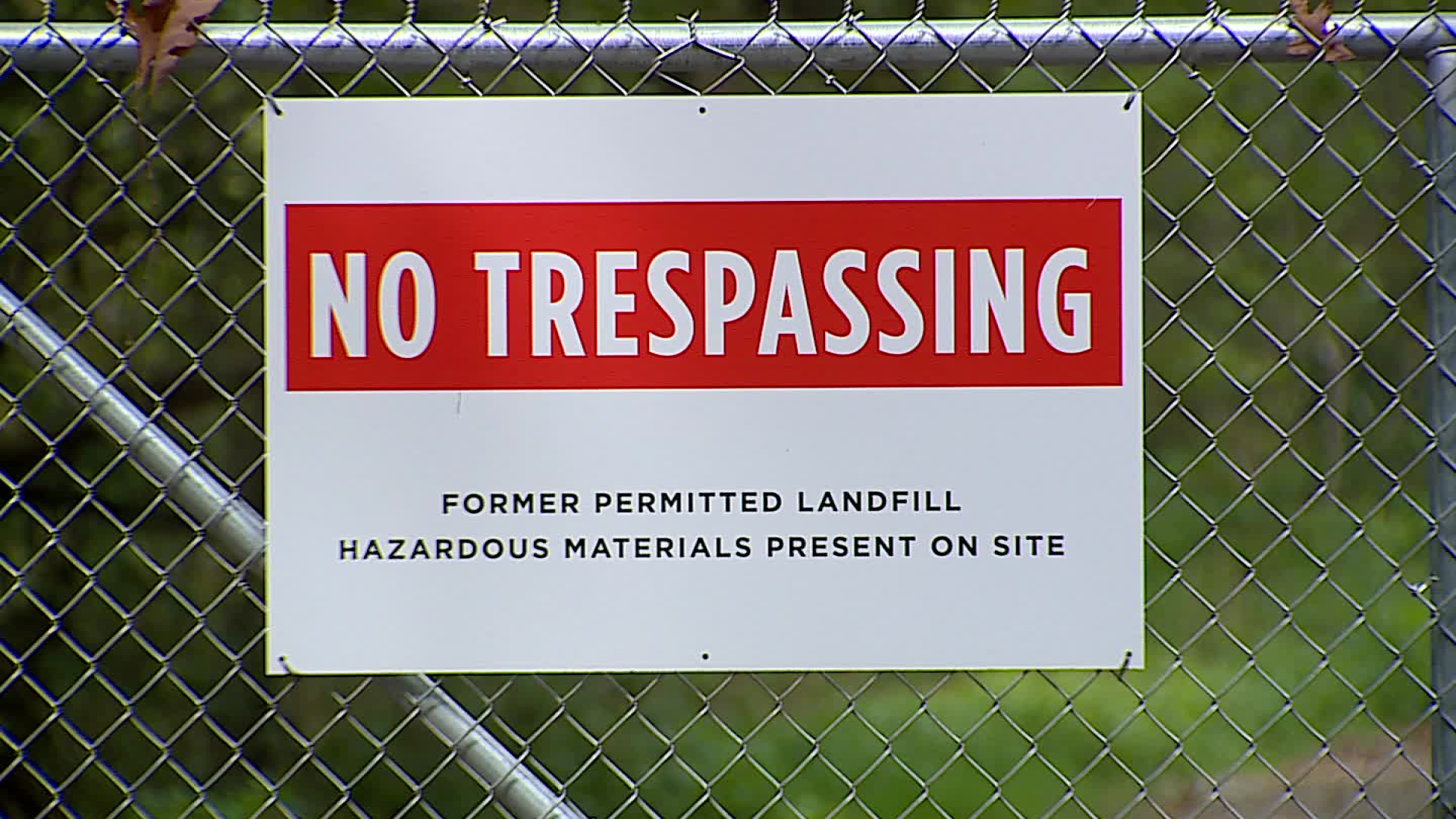 A warning sign at the gate of the old House Street dump where Wolverine Worldwide left PFAS-tainted sludge that contaminated nearby wells. (Sept. 21, 2022)