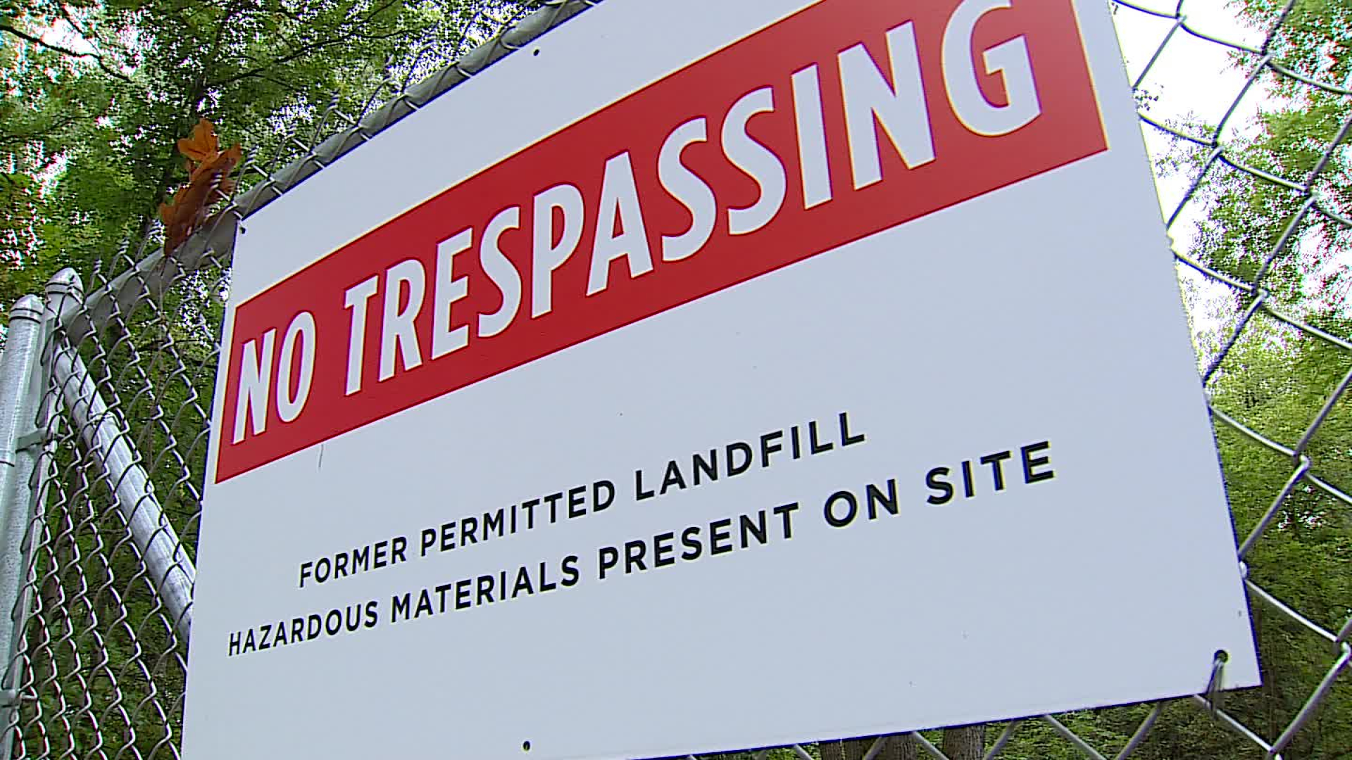 A warning sign at the gate of the old House Street dump where Wolverine Worldwide left PFAS-tainted sludge that contaminated nearby wells. (Sept. 21, 2022)
