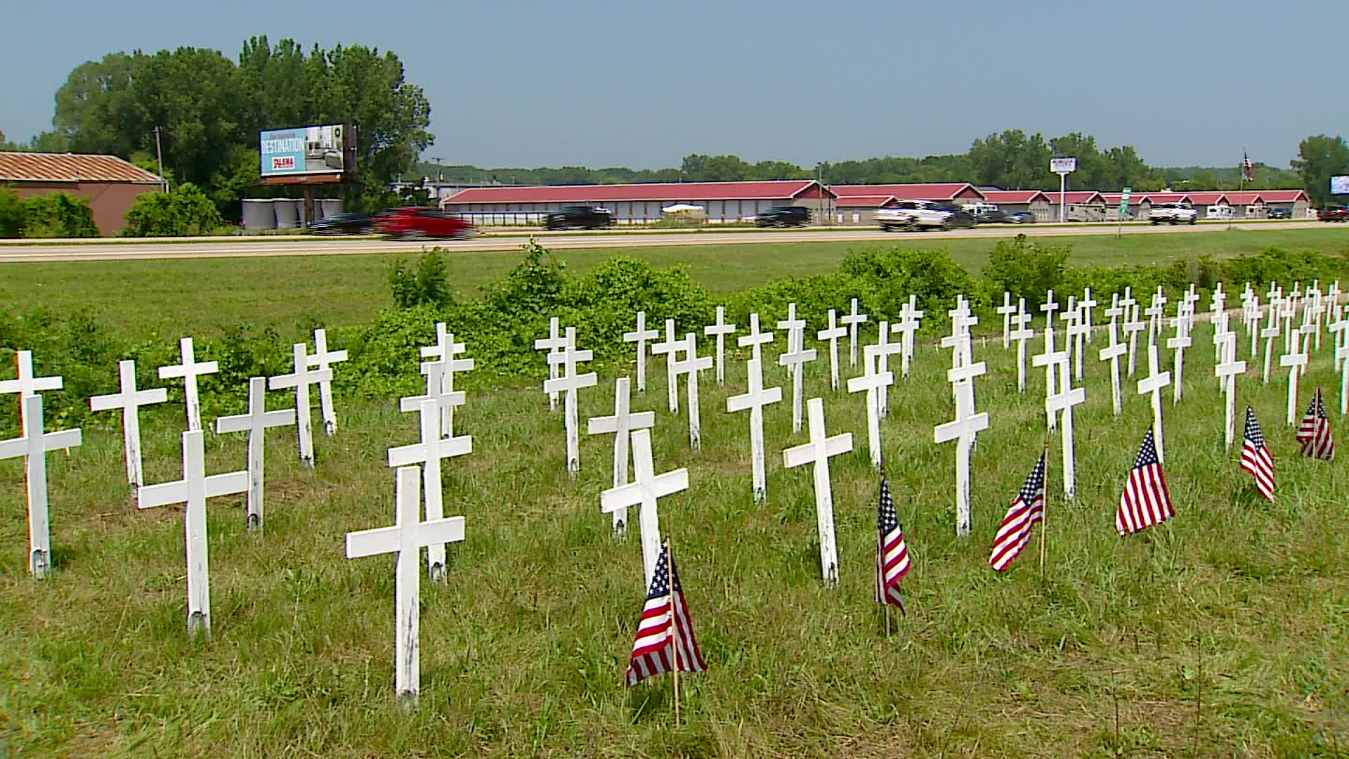 A veteran suicide awareness memorial along US-131 near LMCU Ballpark north of Grand Rapids. (July 27, 2023)