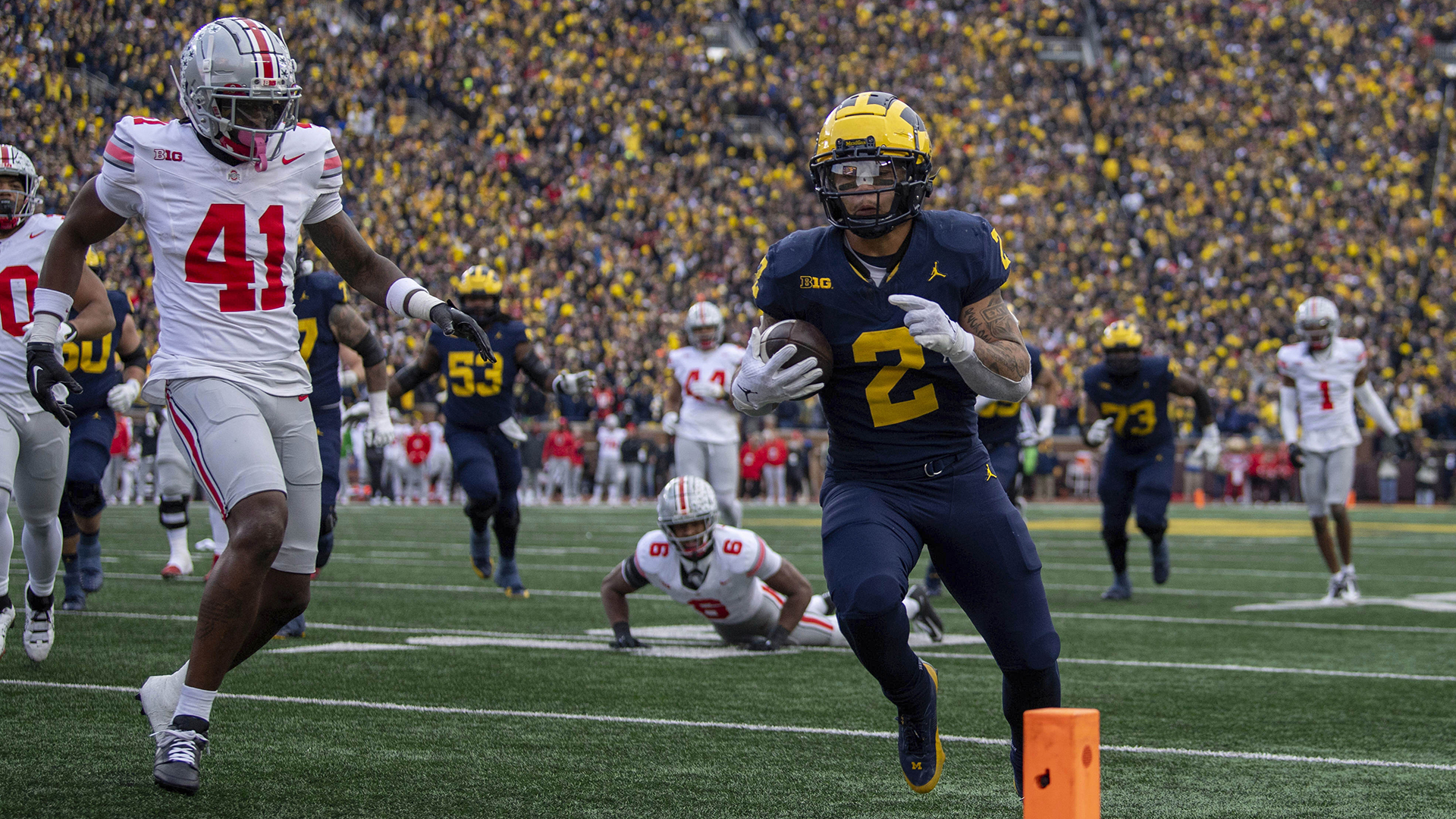 Michigan running back Blake Corum runs to the end zone to score a touchdown during the second half of an NCAA college football game against Ohio State, Saturday, Nov. 25, 2023, in Ann Arbor, Mich. Michigan won 30-24. (AP Photo/David Dermer)