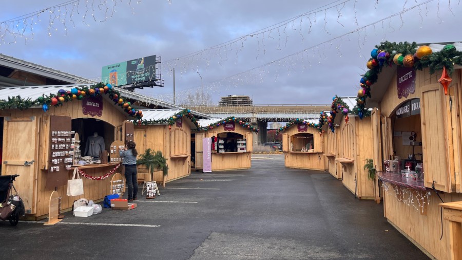 Vendors prepare their stalls at the Grand Rapids Christkindl Markt. (Nov. 17, 2023)