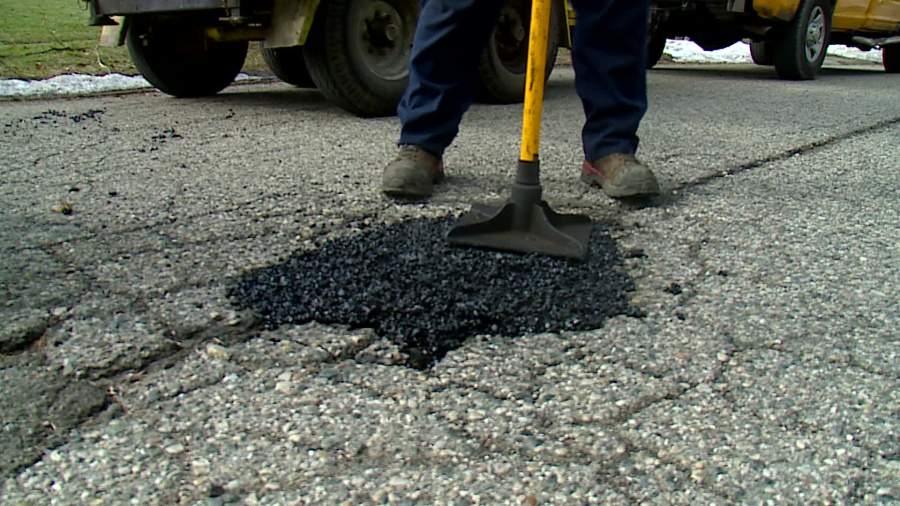 Grand Rapids crews patch a pothole on Feb. 6, 2024.