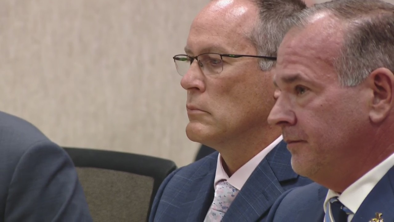 Former MSP Detective Sgt. Brian Keely (background) next to his attorney Marc Curtis in a courtroom in Kentwood as his preliminary haring gets underway on Aug. 12, 2024.