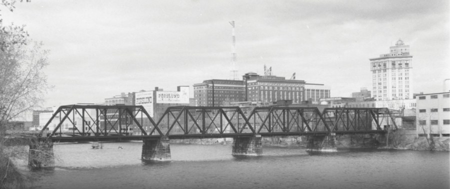 A photo showing the Grand Rapids & Indiana Railroad Bridge crossing the Grand River in downtown Grand Rapids. The photo is believed to have been taken in the 1950s or 1960s. (Courtesy Grand Rapids Public Library)