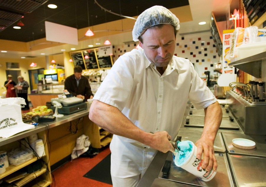 Bill Klein scoops out some Blue Moon ice cream at the Babcock Hall Dairy Store on the University of Wisconsin campus in a 2007 file photo. (AP file)