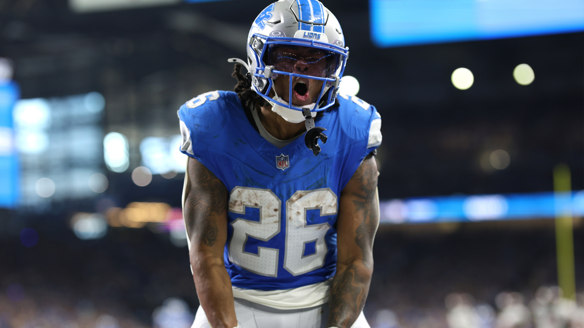 Jahmyr Gibbs celebrates after a big play.