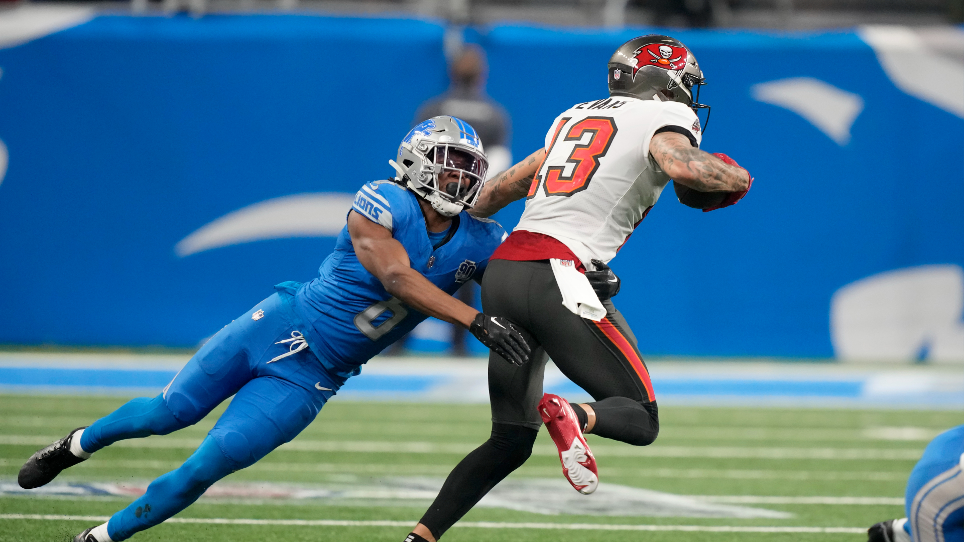 Detroit Lions safety Ifeatu Melifonwu tries to tackle Tampa Bay's Mike Evans during a 2024 NFC divisional playoff game. (AP file)