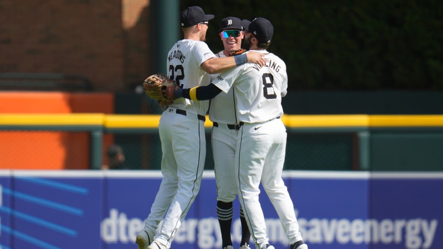 Detroit Tigers' Parker Meadows, from left, Kerry Carpenter and Matt Vierling (8) celebrate after the final out against the Boston Red Sox in a baseball game, Sunday, Sept. 1, 2024, in Detroit. (AP Photo/Paul Sancya)