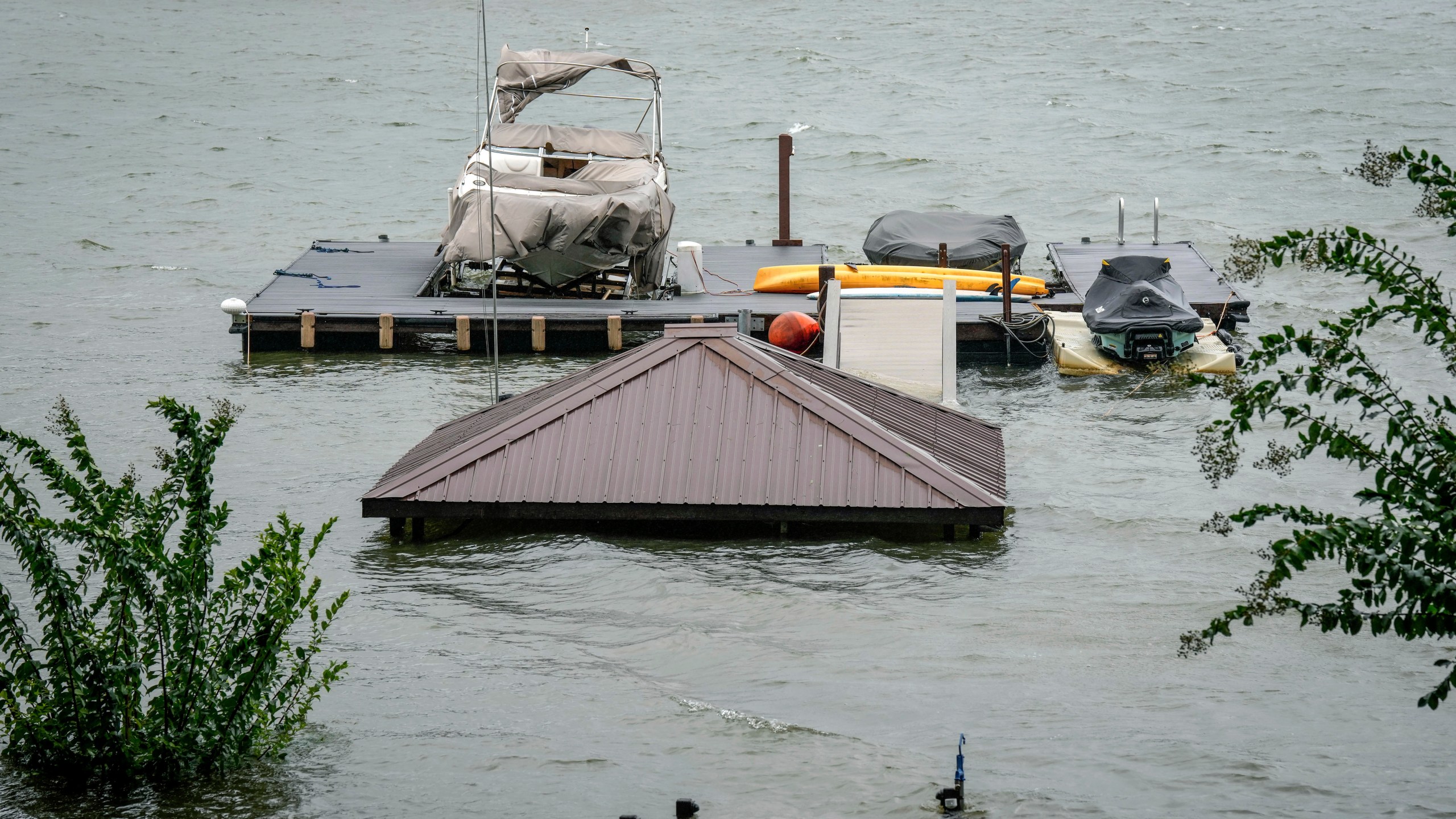 A gazebo and the stairs that lead to it are flooded and under water after Hurricane Helene passed the area on Lake James, Friday, Sept. 27, 2024 in Morganton, N.C. (AP Photo/Kathy Kmonicek)