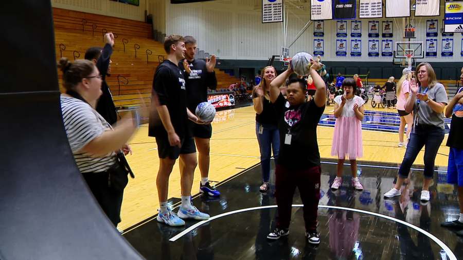Grand Valley State University basketball players work with people with disabilities through the Beautiful Lives Project's Court of Dreams event on Sept. 18, 2024.