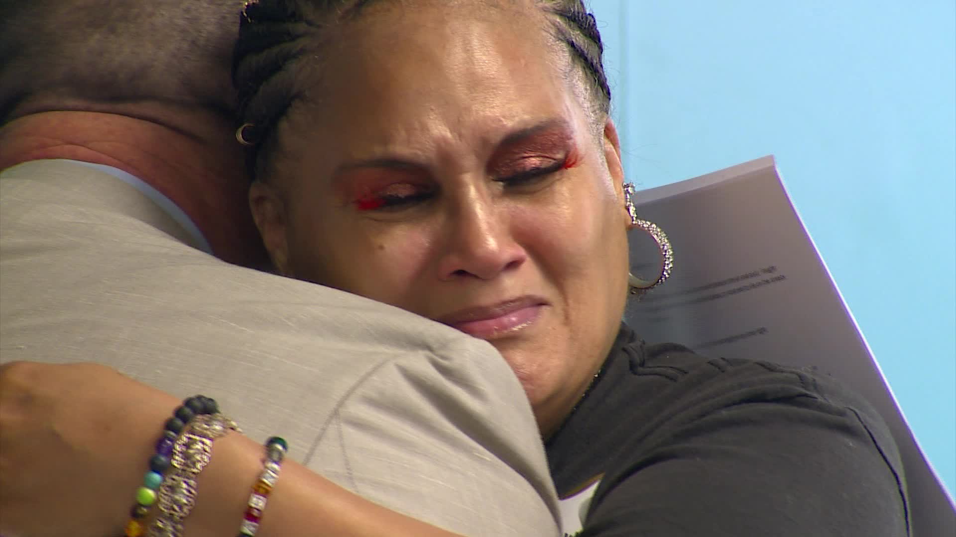 Kelly Palmer gets emotional as she graduates from Kent County's mental health treatment court on Sept. 19, 2024.