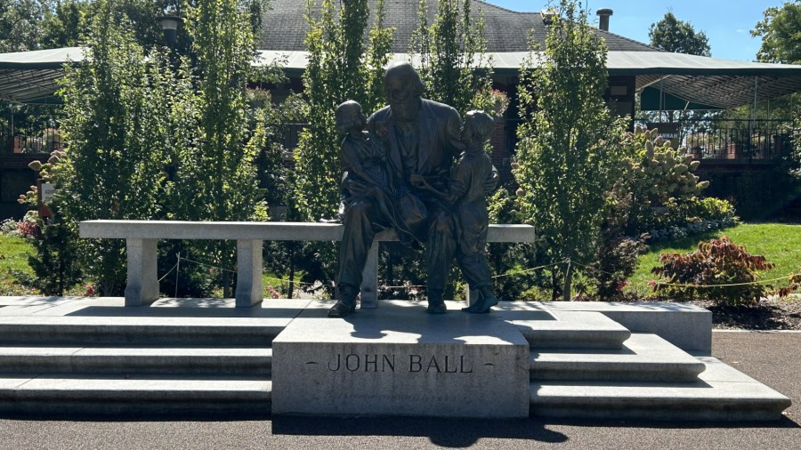A statue of John Ball and two young children was sculpted by Pompeo Coppini and installed at John Ball Park in 1925. It now resides outside the entrance to the zoo. (Matt Jaworowski/WOOD TV8)