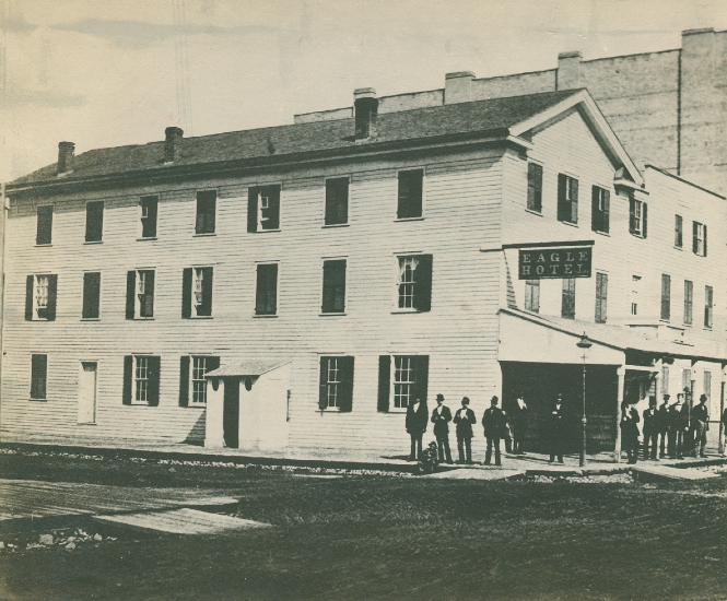 The Eagle Hotel, shown here in 1880, was built in 1834. John Ball first lodged at the Eagle Hotel when he arrived in Grand Rapids in 1836. The hotel was on Waterloo Street, which is now called Market Street. The building burned down in 1883. (Courtesy Grand Rapids Public Library)