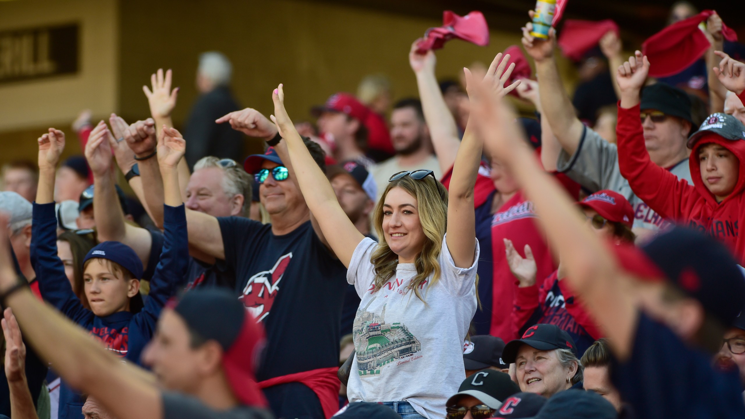 Fans cheer in the fifth inning during Game 1 of baseball's AL Division Series between the Detroit Tigers and the Cleveland Guardians, Saturday, Oct. 5, 2024, in Cleveland. (AP Photo/Phil Long)