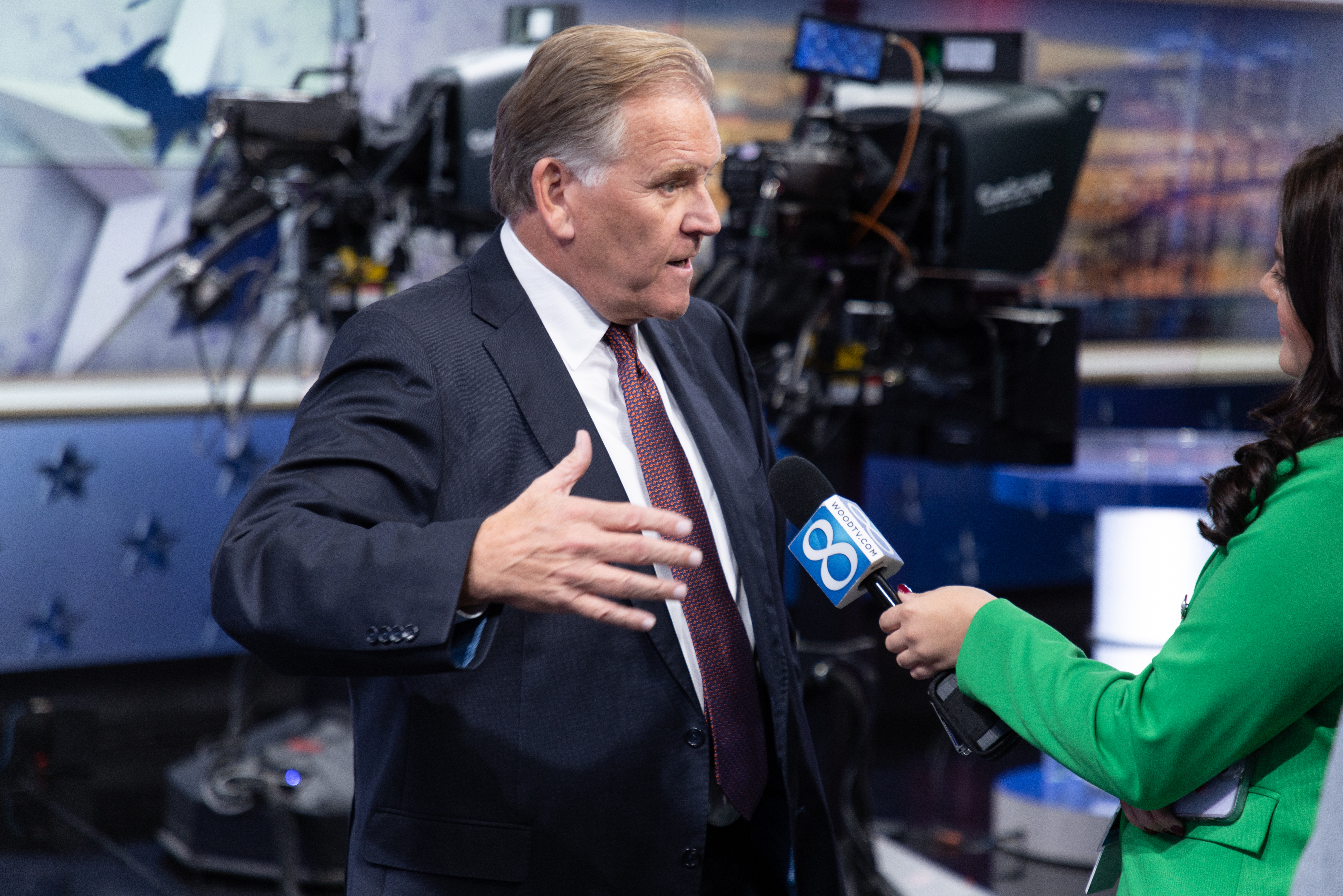 Former U.S. Rep. Mike Rogers speaks with News 8's Adriana Doria following a debate at WOOD TV8 on Oct. 8, 2024. (Michael Buck/WOOD TV8)