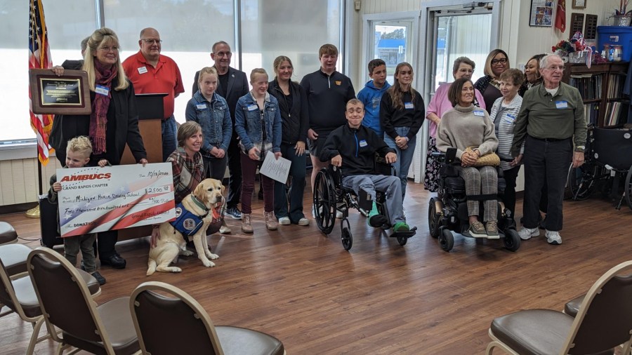 The Grand Rapids chapter of AMBUCS presented the Marge Wilson Community Service Award and a $2,500 check to the Michigan Horse Driving School in Saranac during an event in Wyoming on Oct. 16, 2024.
