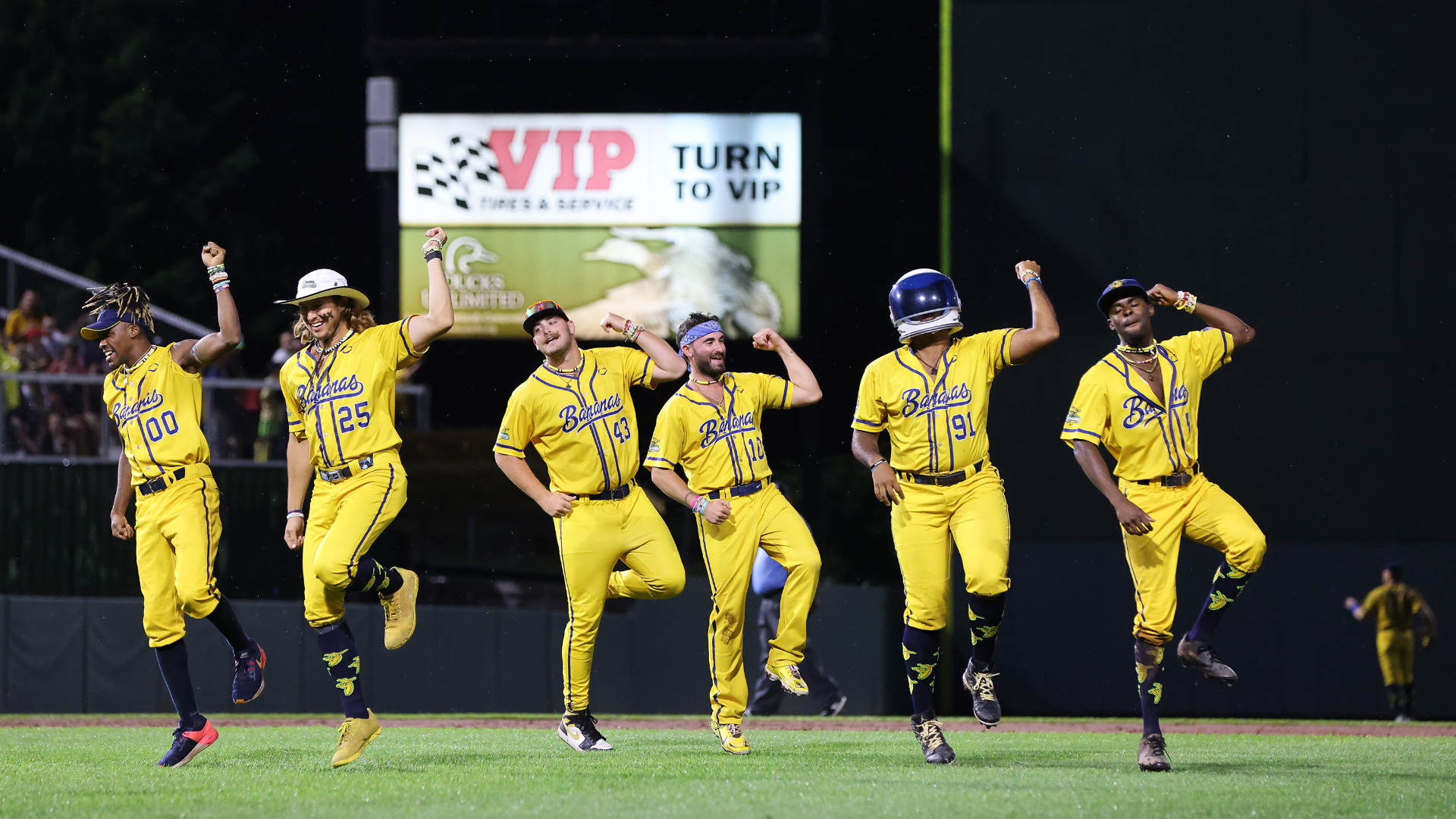 PORTLAND, ME - AUGUST 18: The Savannah Bananas dance on the field between innings. (Staff photo by Ben McCanna/Staff Photographer)