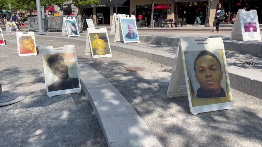 Photos of those who lost their lives are displayed at the "Stop the Hate, Stop the Violence" event at Rosa Parks Circle on Saturday, Oct. 5, 2024.