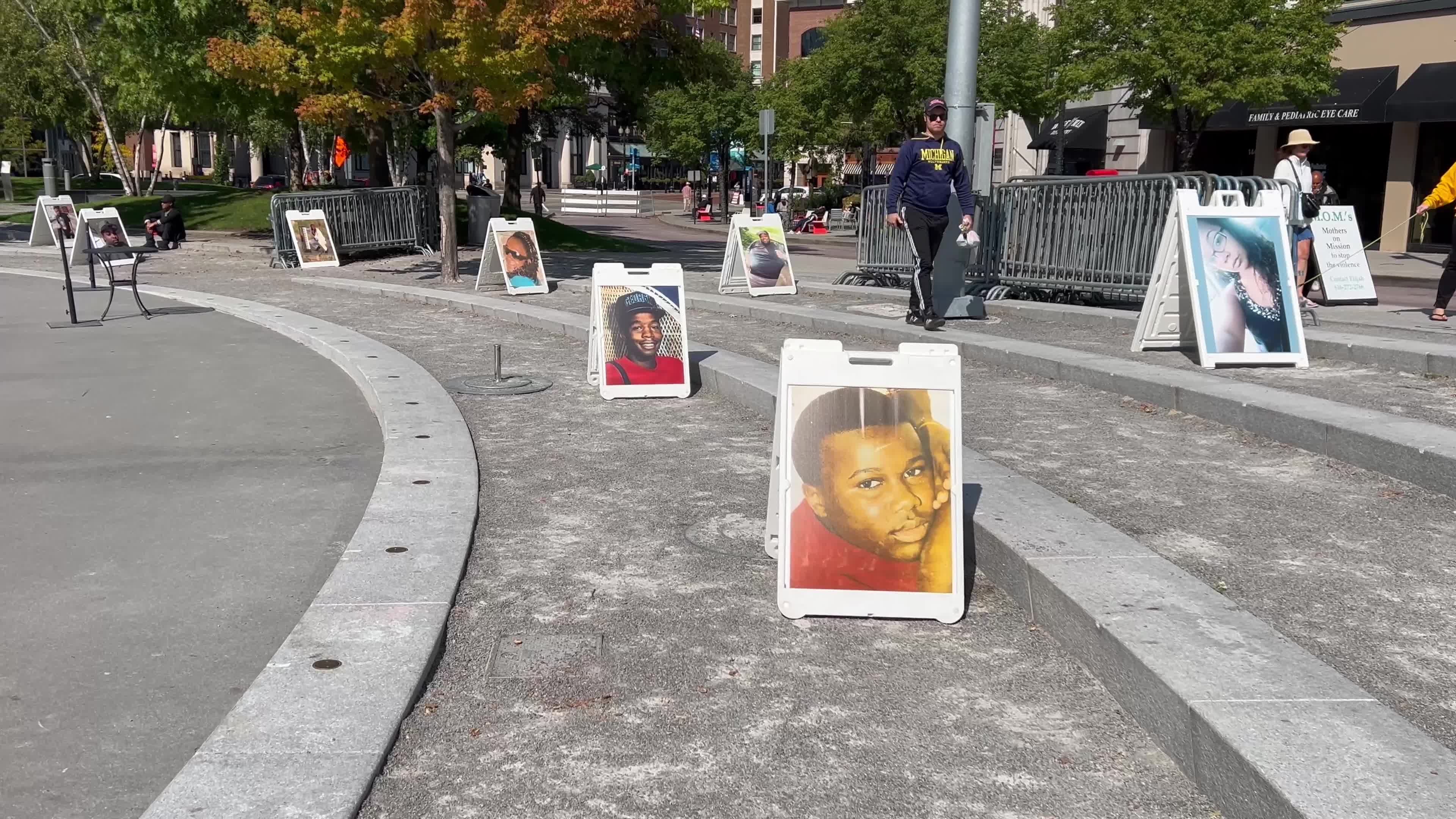 Photos of those who lost their lives are displayed at the "Stop the Hate, Stop the Violence" event at Rosa Parks Circle on Saturday, Oct. 5, 2024.