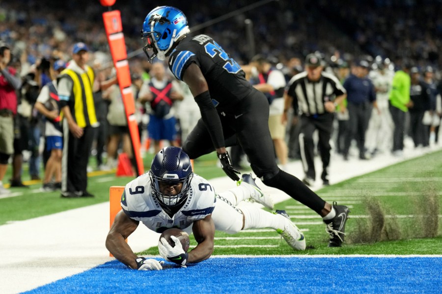 Seattle's Kenneth Walker scores one of his three touchdowns in Monday night's 42-29 loss to the Detroit Lions. (Getty Images)