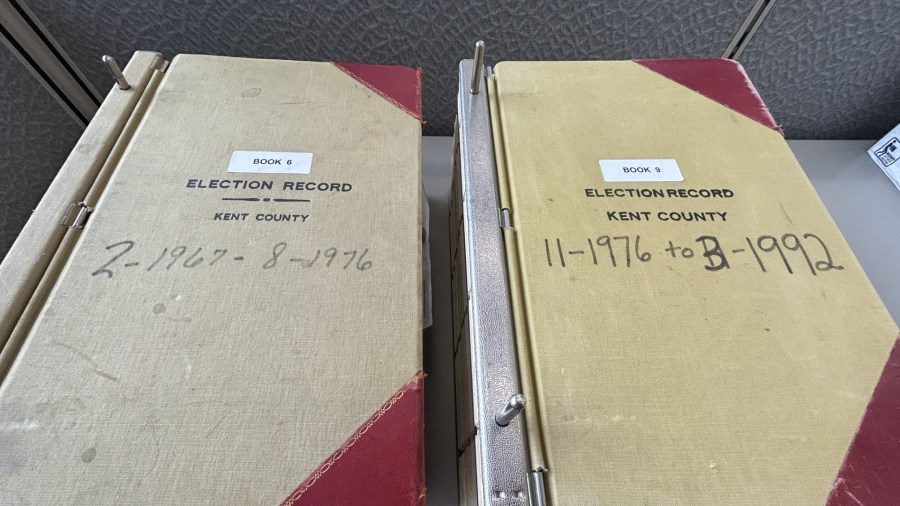 The Kent County Clerk's Office still has old paper records of the county's past elections, including these 20th century binders. (Matt Jaworowski/WOOD TV8)