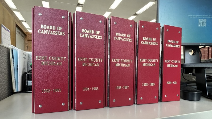 A group of binders hold the results from every election held in Kent County between 1992 and 2001. (Matt Jaworowski/WOOD TV8)