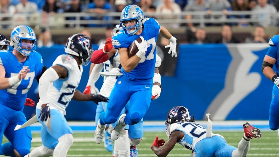 Detroit Lions tight end Sam LaPorta runs with the ball against the Tennessee Titans on Sunday, Oct. 27, 2024, in Detroit. (Carlos Osorio/AP)