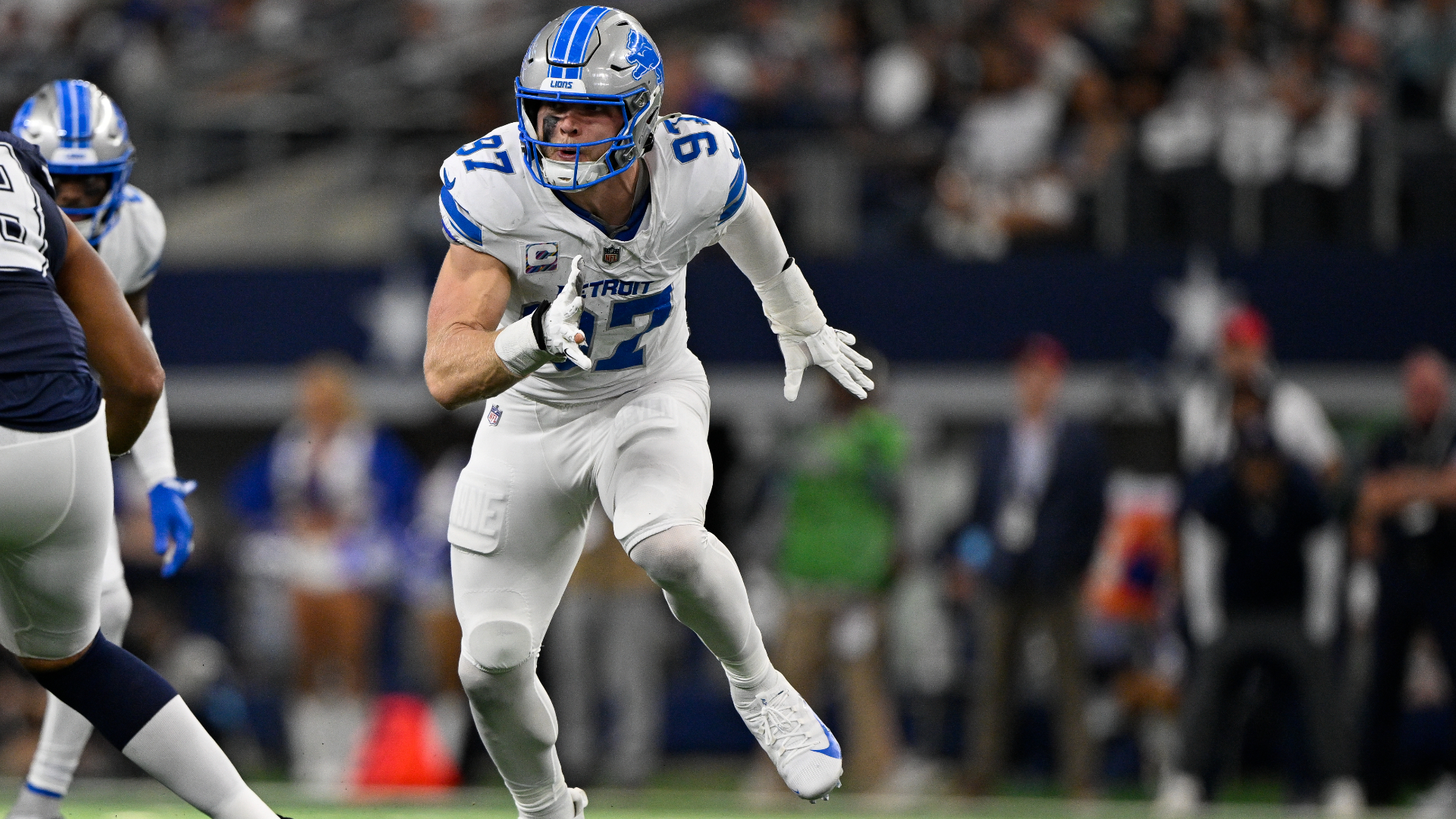 Detroit Lions defensive end Aidan Hutchinson (97) rushes the line during an NFL football game against the Dallas Cowboys in Arlington, Texas, Sunday, Oct. 13, 2024. (AP Photo/Jerome Miron)