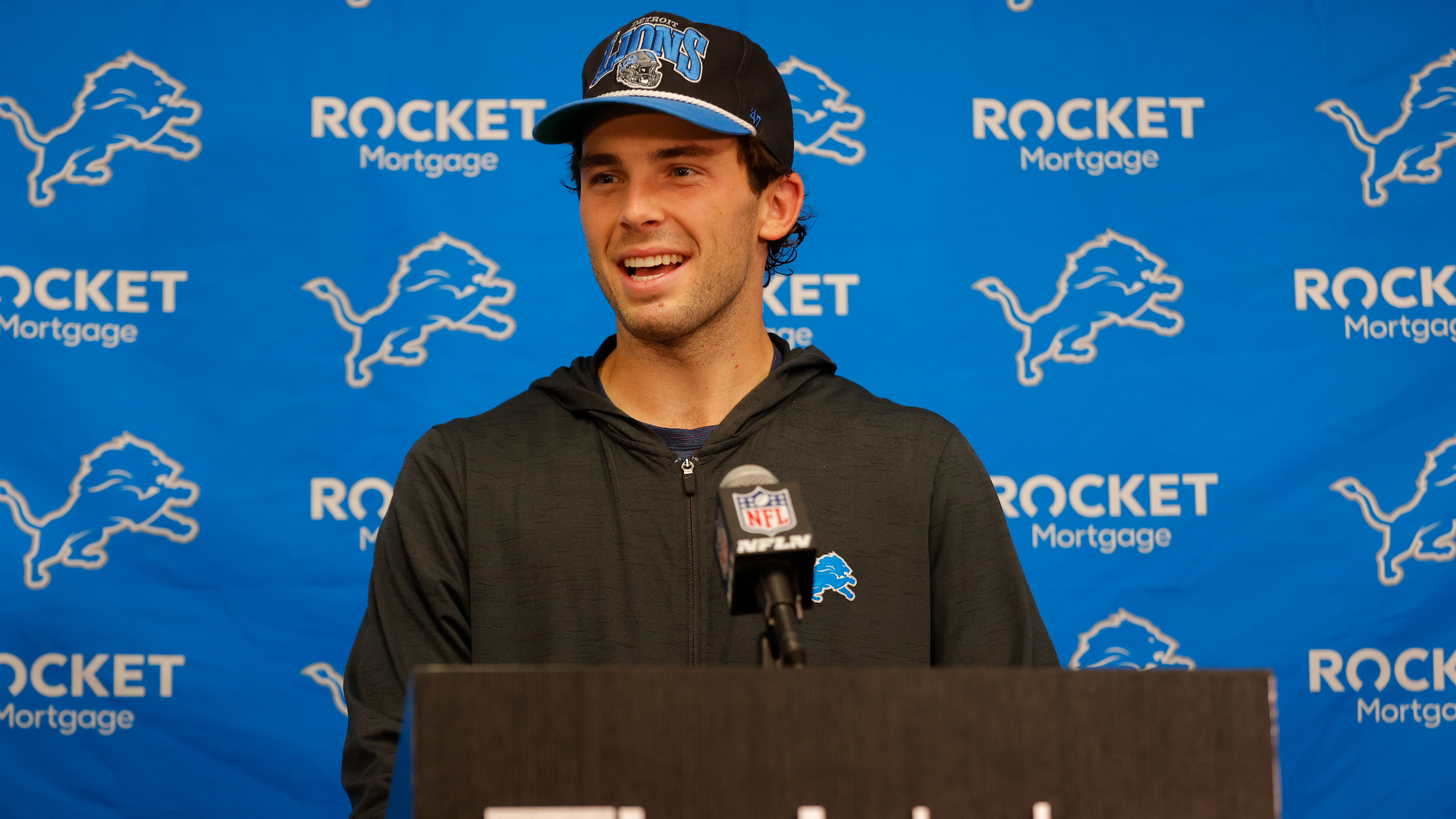 Detroit Lions place kicker Jake Bates speaks to the media after an NFL football game against the Minnesota Vikings, Sunday, Oct. 20, 2024, in Minneapolis. (AP Photo/Bruce Kluckhohn)