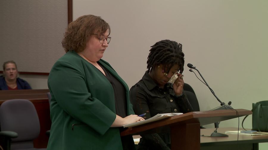 Berline Burkholder wipes her eyes as she is sentenced in a Grand Rapids courtroom on Oct. 14, 2024.
