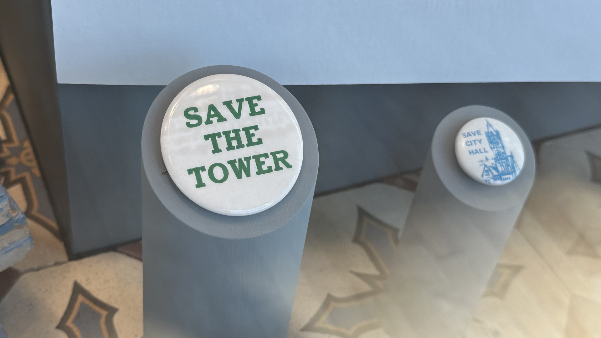Pins in support of saving the old Grand Rapids City Hall on display at the Grand Rapids Public Museum. (Oct. 15, 2024)