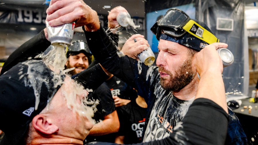 Detroit Tigers Manager A.J. Hinch, left, celebrates with pitching coach Chris Fetter after the team clinched a playoff berth with a win over the Chicago White Sox on Sept. 27, 2024. (Getty Images)