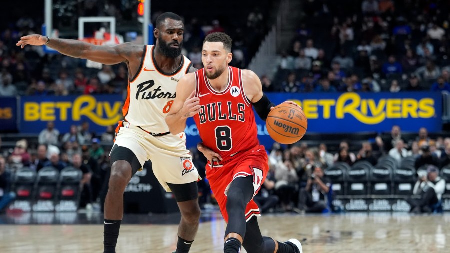 Chicago Bulls guard Zach LaVine (8) drives as Detroit Pistons forward Tim Hardaway Jr. (8) defends during the first half of an NBA basketball game, Monday, Nov. 18, 2024, in Detroit. (AP Photo/Carlos Osorio)