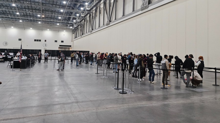 People in line for same-day registration and voting at DeVos Place in Grand Rapids shortly after polls closed. Anyone in line before 8 p.m. would be allowed to register and vote.