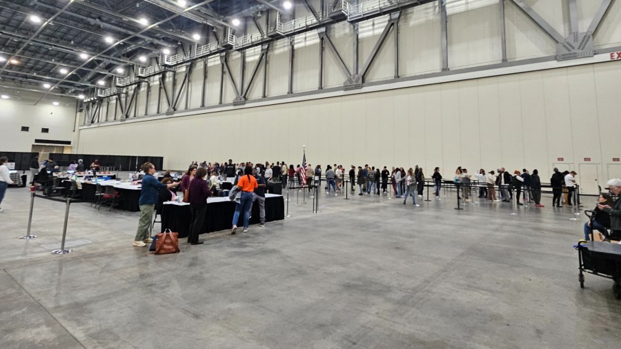 People in line for same-day registration and voting at DeVos Place in Grand Rapids shortly after polls closed. Anyone in line before 8 p.m. would be allowed to register and vote.