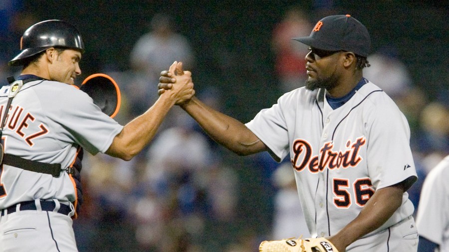 In this 2006 file photo, Fernando Rodney, right, celebrates with Pudge Rodriguez after closing out a game against the Texas Rangers. (AP file)