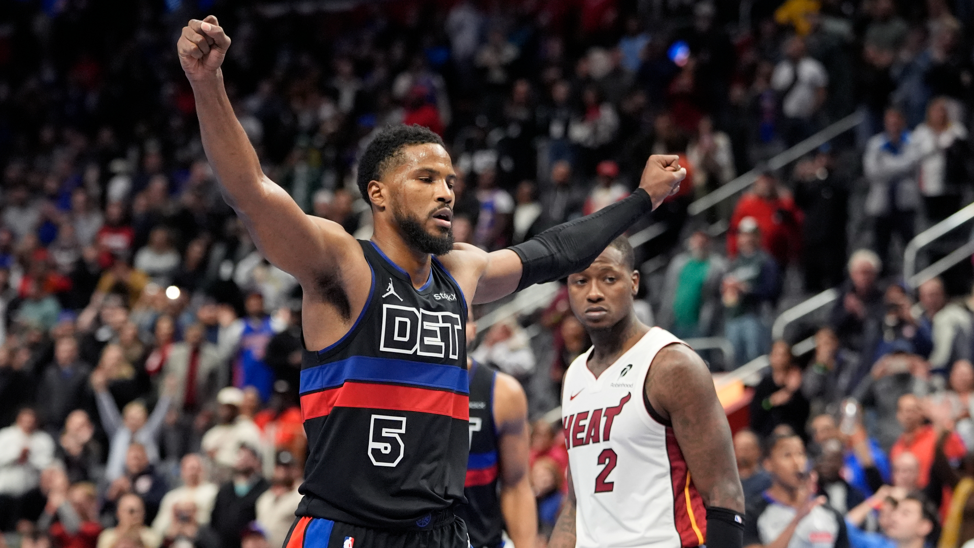 Detroit Pistons guard Malik Beasley (5) raises his arms after making freethrows to win the game against the Miami Heat during overtime of an Emirates NBA Cup basketball game, Tuesday, Nov. 12, 2024, in Detroit. (AP Photo/Carlos Osorio)