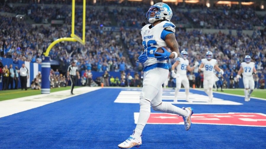 Detroit Lions running back Jahmyr Gibbs (26) runs into the endzone for a 1-yard rushing touchdown during the first half of an NFL football game against the Indianapolis Colts, Sunday, Nov. 24, 2024, in Indianapolis. (AP Photo/AJ Mast)