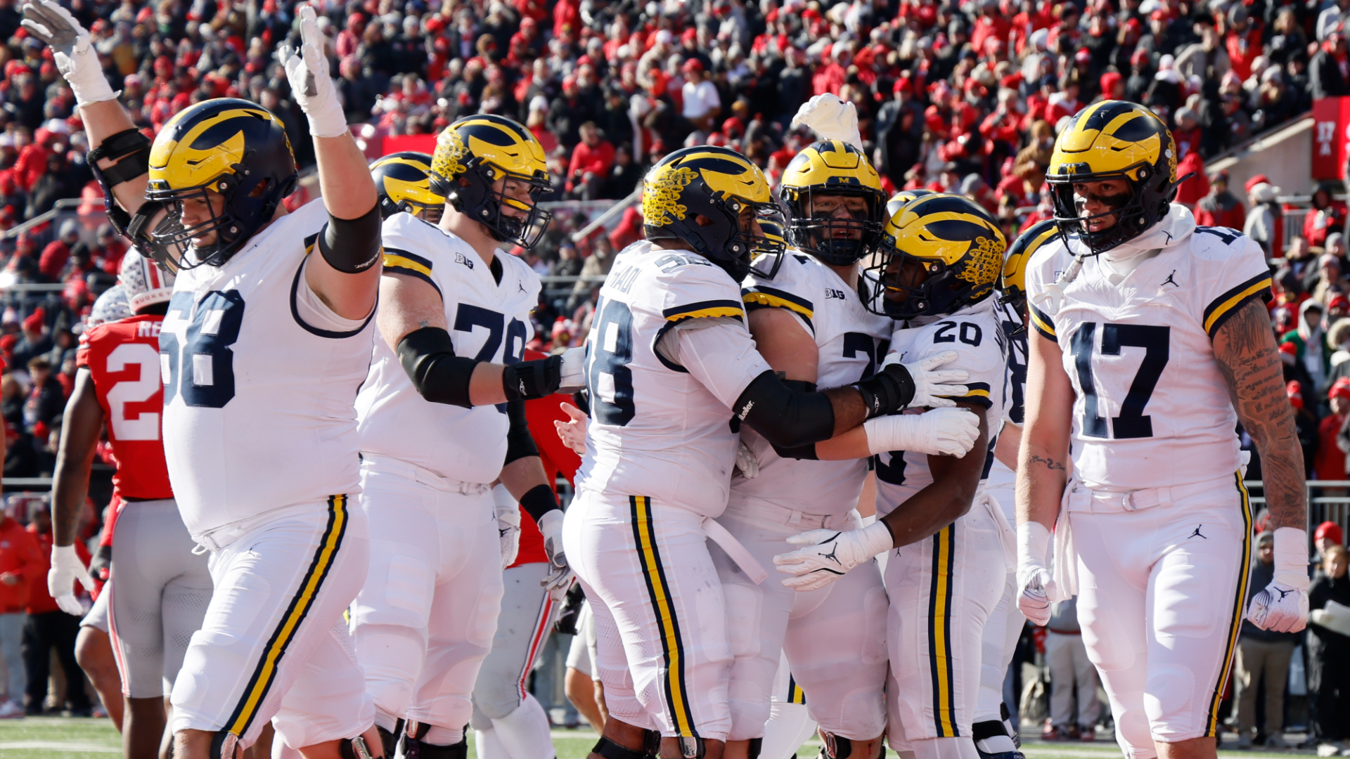 Michigan players celebrate their touchdown against Ohio State during the first half of an NCAA college football game Saturday, Nov. 30, 2024, in Columbus, Ohio. (AP Photo/Jay LaPrete)