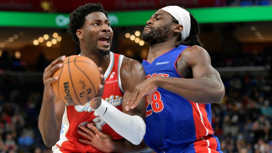 Memphis Grizzlies forward Jaren Jackson Jr. (13) handles the ball against Detroit Pistons center Isaiah Stewart (28) in the first half of an NBA basketball game Wednesday, Nov. 27, 2024, in Memphis, Tenn. (AP Photo/Brandon Dill)