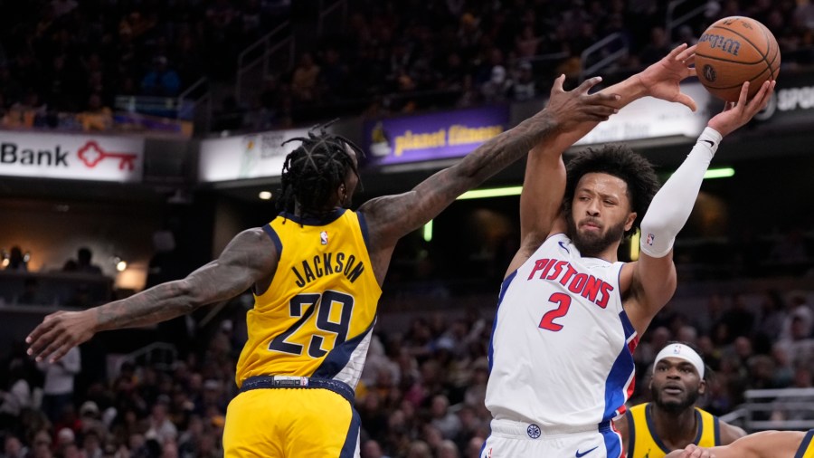 Detroit Pistons' Cade Cunningham (2) is fouled by Indiana Pacers' Quenton Jackson (29) during the first half of an Emirates NBA Cup basketball game, Friday, Nov. 29, 2024, in Indianapolis. (AP Photo/Darron Cummings)