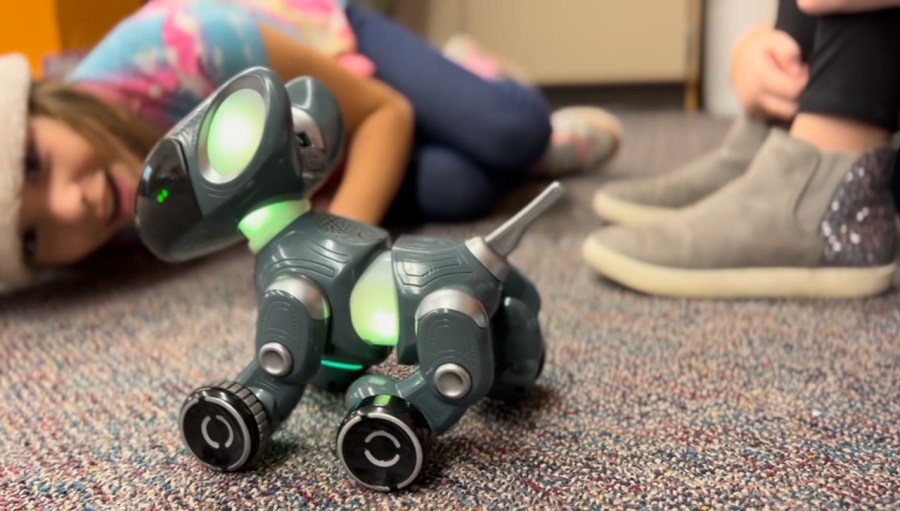 Kids play with a Pyxel robot dog in Andy Losik's classroom. (Nov. 18, 2024)