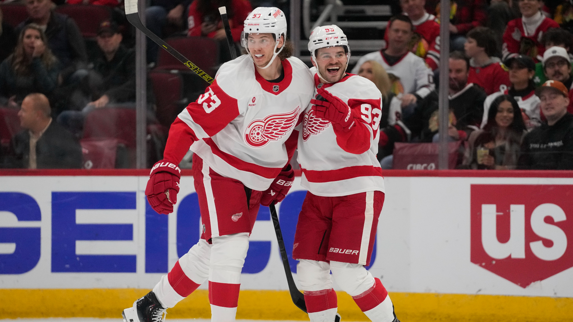 Detroit Red Wings defenseman Moritz Seider, left, and right wing Alex DeBrincat celebrate after DeBrincat scored on the Chicago Blackhawks during the first period of an NHL hockey game Wednesday, Nov. 6, 2024, in Chicago. (AP Photo/Erin Hooley)