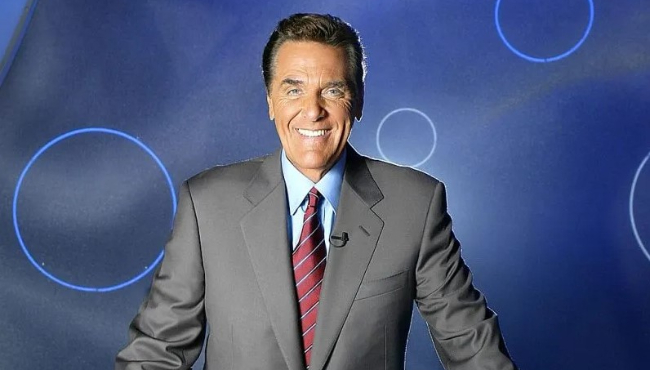 LOS ANGELES, CA - OCTOBER 22: Host of the Game Show Network Show, Lingo Chuck Woolery poses on the set October 22, 2003 in Los Angeles California. (Photo by Carlo Allegri/Getty Images for the Game Show Network)