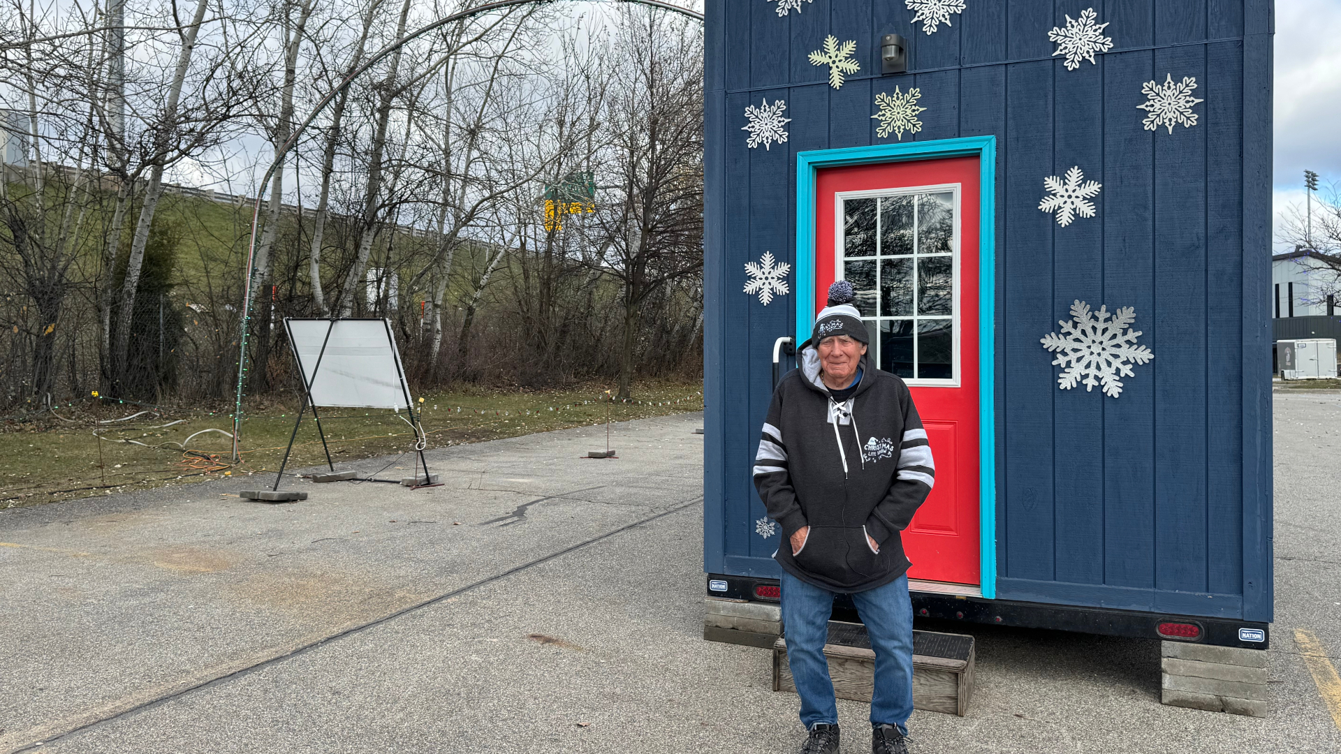 Bill Schrader stands outside the Christmas Lite Show ticket booth at LMCU Ballpark on Nov. 26, 2024.