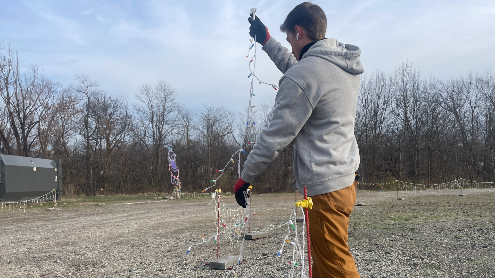 Workers repair damage after the Christmas Lite Show at LMCU Ballpark north of Grand Rapids was vandalized. (Nov. 27, 2024)