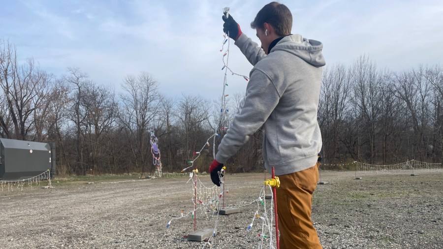 Workers repair damage after the Christmas Lite Show at LMCU Ballpark north of Grand Rapids was vandalized. (Nov. 27, 2024)