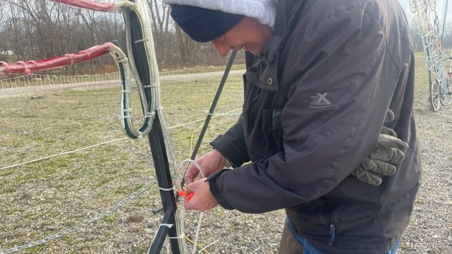 Workers repair damage after the Christmas Lite Show at LMCU Ballpark north of Grand Rapids was vandalized. (Nov. 27, 2024)
