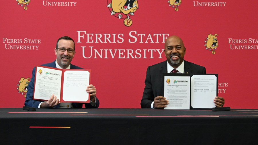 Newaygo County Area Promize Zone Chairperson Blake Prewitt and Ferris State President Bill Pink sign an agreement on Nov. 22, 2024. (Courtesy Ferris State)
