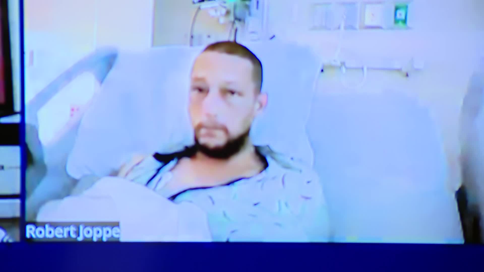 Robert Joppe appears in a Kent County courtroom from his hospital bed for arraignment on Nov. 25, 2024.